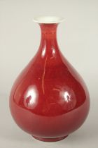 A CHINESE COPPER RED GLAZE YUHUCHUNPIN VASE. 27cms high.