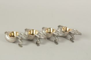 A SET OF FOUR CAST PLATE FROG AND SNAIL SALTS.