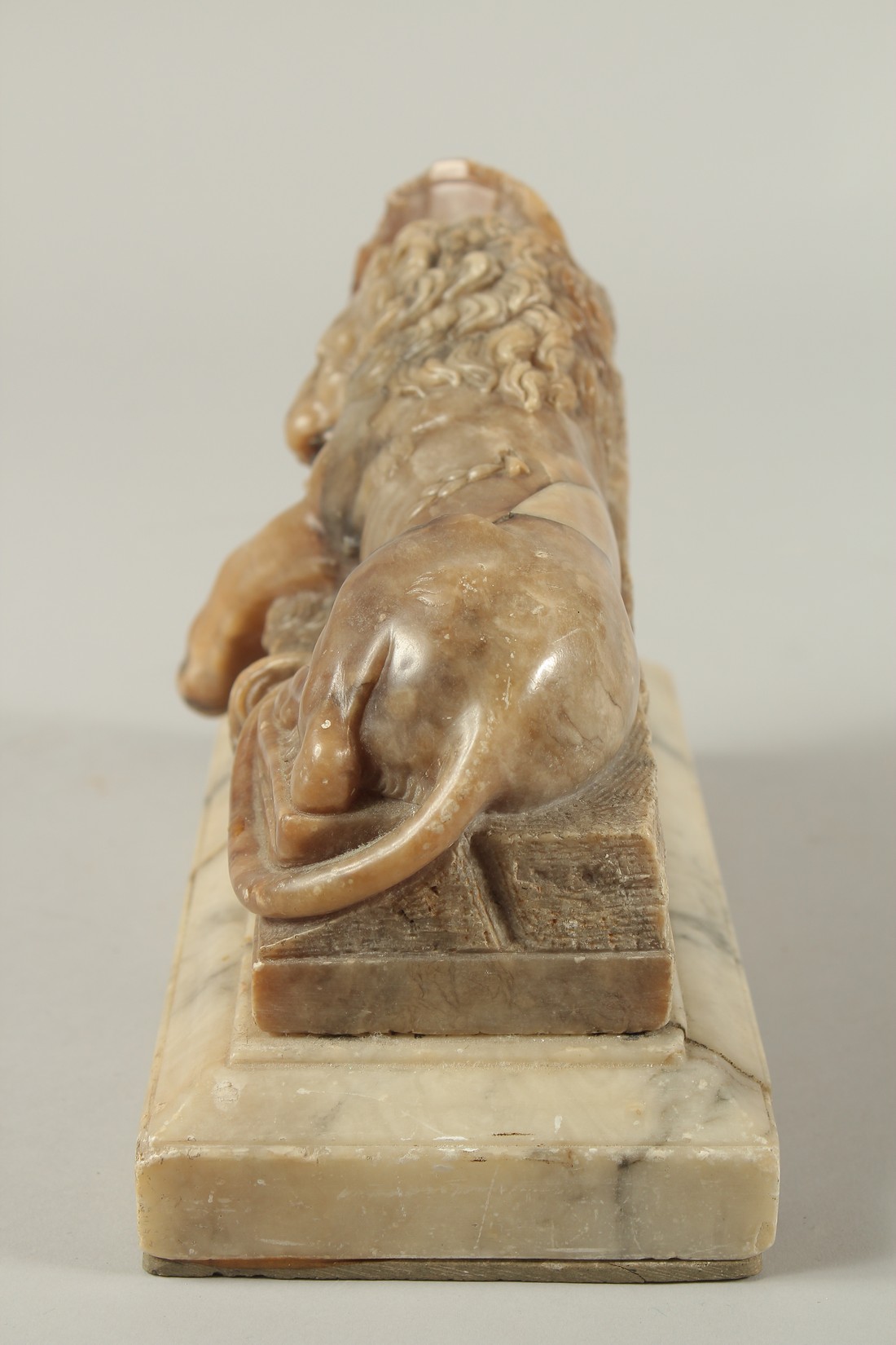 THE LION OF LUCERNE. A SOAPSTONE CARVING OF A LION on a marble base. See label on reverse. 9ins - Image 6 of 7