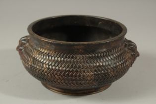 A GOOD CHINESE LATTICE WORK BRONZE CIRCULAR CENSER with lion handles. Impresssed mark. 15cms