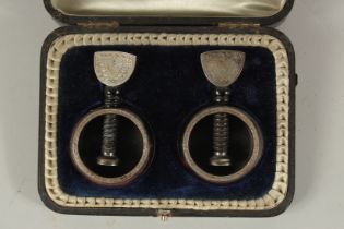 A PAIR OF VICTORIAN SILVER MOUNTED NUT CRACKERS. Sheffield 1891, in a fitted box.