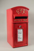 A RED CAST IRON POST BOX. 55cms high.