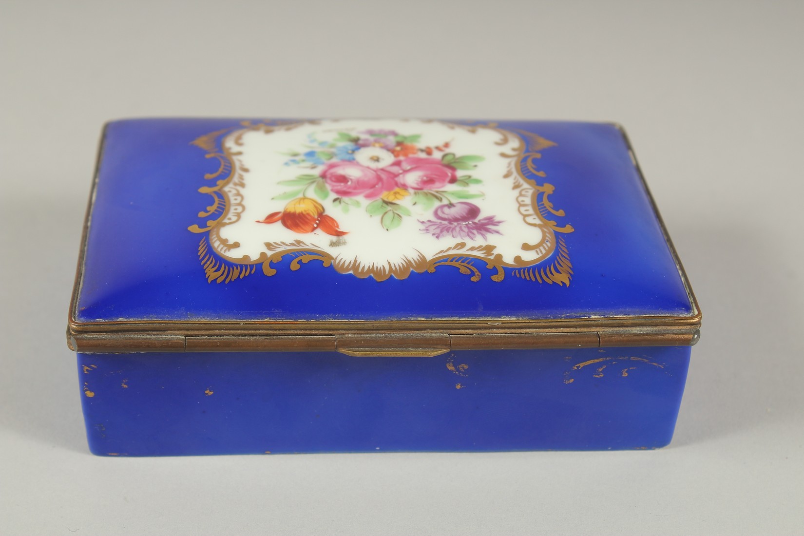 A SEVRES PORCELAIN BOX AND COVER with blue ground, with a panel of flowers. 5ins long. - Image 2 of 6