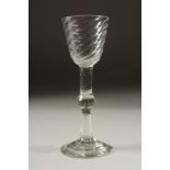 A GEORGIAN WINE GLASS with spiral cup and knop stem. 6.25ins high.