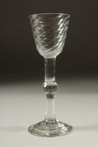 A GEORGIAN WINE GLASS with spiral cup and knop stem. 6.25ins high.