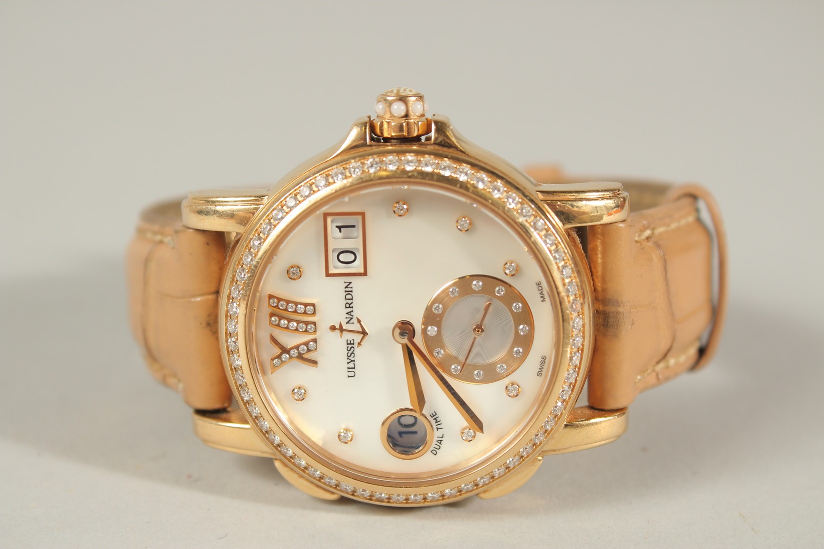 A SUPERB ULYSSE NARDIN 18CT ROSE GOLD WRISTWATCH with mother-of-pearl face, diamond surround, date