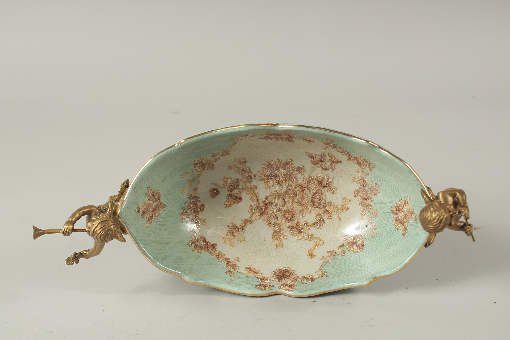 A SEVRES STYLE PORCELAIN AND GILT METAL OVAL COMPORT with cupid handles. 28cms long. - Image 5 of 5