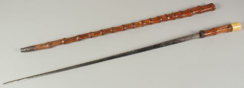 AN EARLY BAMBOO SWORD STICK with bone handle and finely engraved blade. Signed VIRTU. Blade 26ins