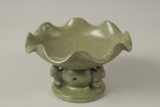 A CHINESE PORCELAIN CELADON GREEN CRACKLE GLAZED BOWL. 15cms diameter.