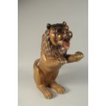 A FINE EARLY 19TH CENTURY INDIAN POSSIBLY MYSORE POLYCHROMED CARVED WOOD LION, 61cm high.