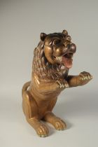 A FINE EARLY 19TH CENTURY INDIAN POSSIBLY MYSORE POLYCHROMED CARVED WOOD LION, 61cm high.