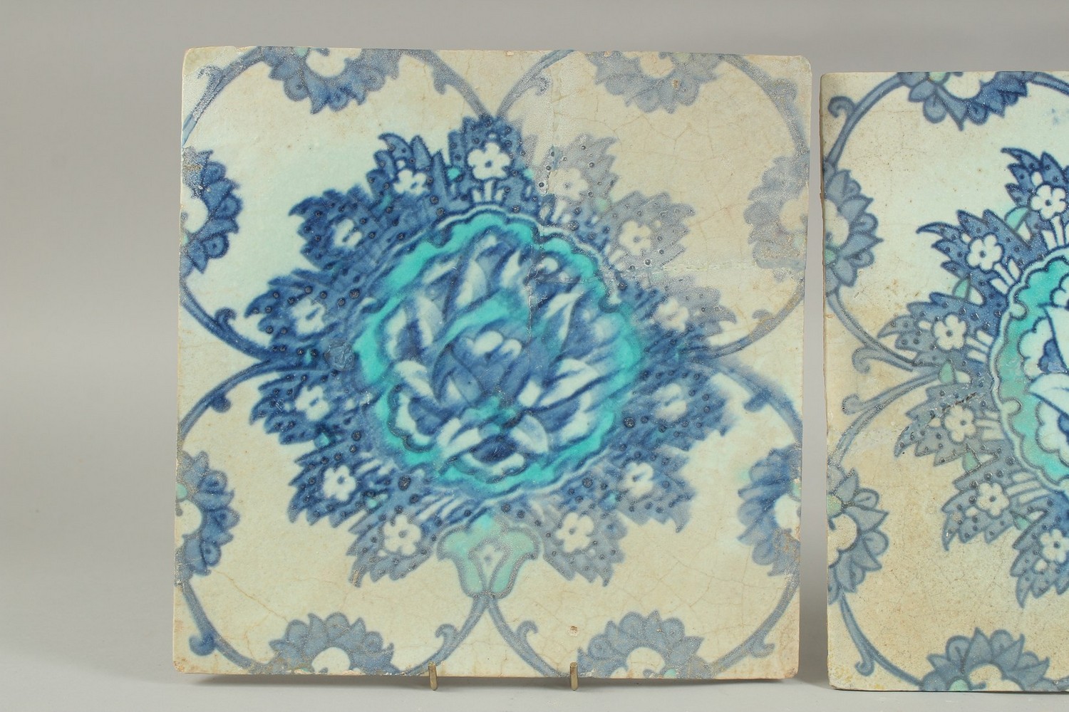 TWO EARLY 17TH CENTURY OTTOMAN IZNIK TILES, depicting a large lotus flower, (2). - Image 2 of 6