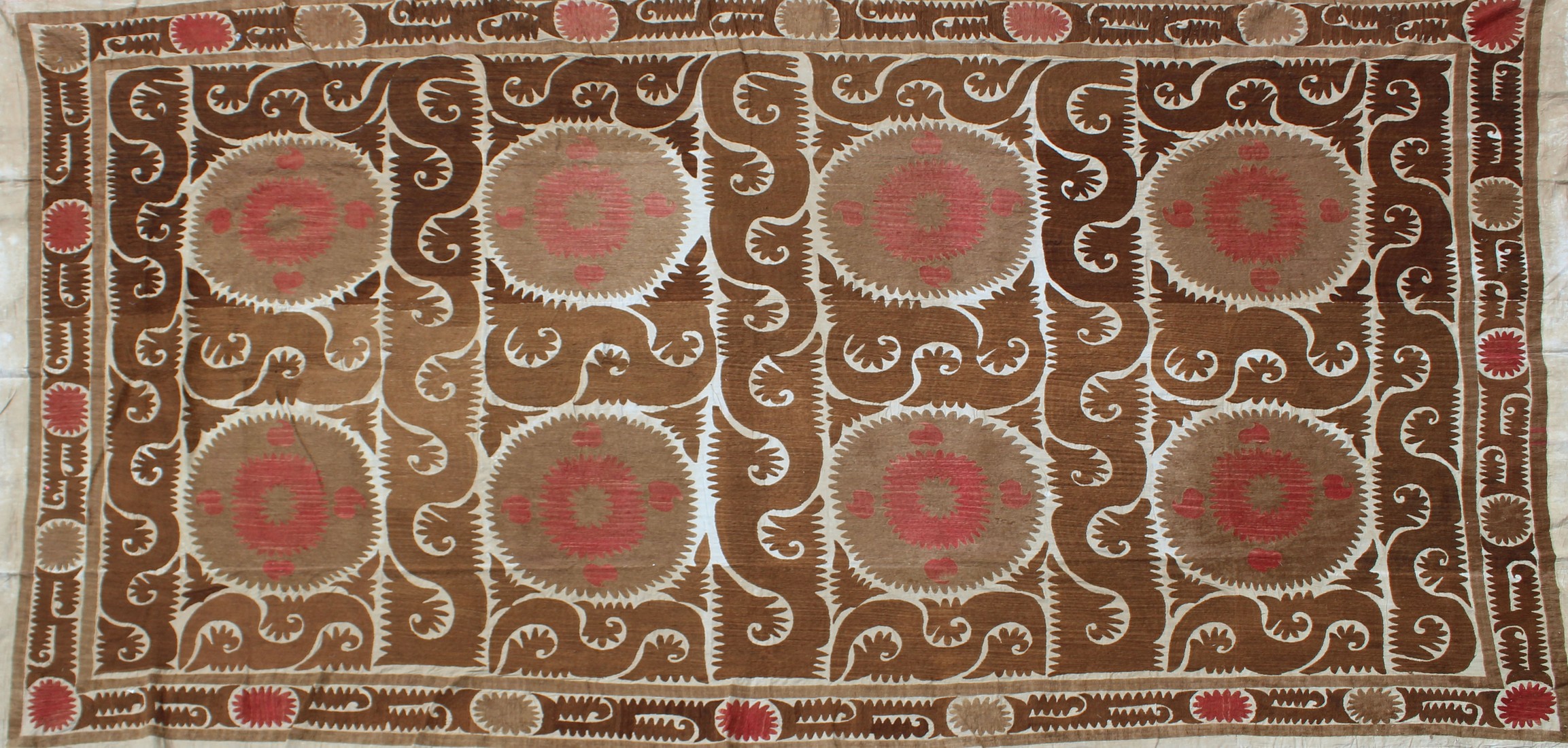 A VERY LARGE 20TH CENTURY SAMARKAND UZBEKISTAN WEDDING SUZANI TEXTILE, in light browns and reds on - Image 2 of 8