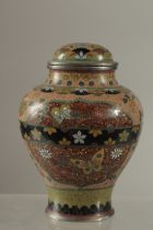 A JAPANESE CLOISONNE LIDDED VASE, with a panel of butterflies and flower heads on glittered