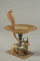 A FINE 19TH CENTURY INDIAN CARVED HORN OFFERING DISH, with a Nandi bull base, lotus shape dish