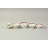 A CHINESE EXPORT FAMILLE ROSE PORCELAIN TEA BOWL, together with three other tea bowls painted with