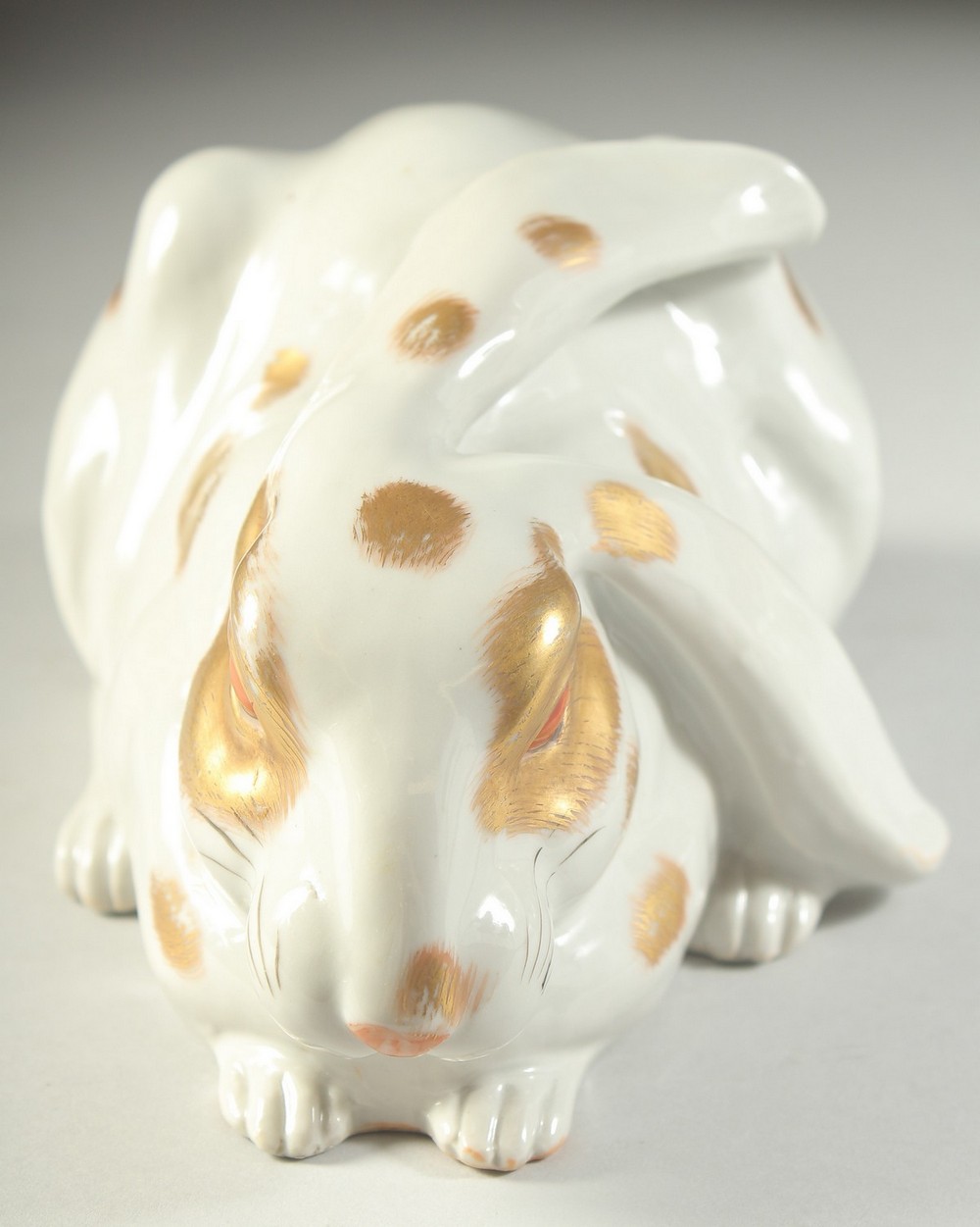 A JAPANESE KUTANI PORCELAIN HARE, with gilded patches and painted red eyes, made in Japan mark, 22cm - Image 2 of 5
