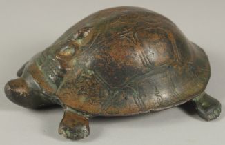A CHINESE BRONZE BUDDHISTIC TURTLE, the shell bearing a seated Buddha, the base with inscriptions,