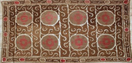 A VERY LARGE 20TH CENTURY SAMARKAND UZBEKISTAN WEDDING SUZANI TEXTILE, in light browns and reds on
