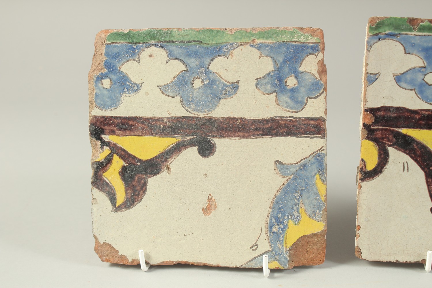 TWO EARLY 19TH CENTURY PERSIAN QAJAR GLAZED POTTERY TILES, 16cm x 16.5cm each, (2). - Image 2 of 3