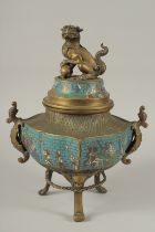 A CHINESE ENAMELLED BRASS TRIPOD CENSER AND COVER, with lion dog finial and twin dragon handles, the