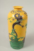 A CHINESE YELLOW GROUND FAHUA-TYPE POTTERY VASE, with raised decoration of dragon, kylin, and