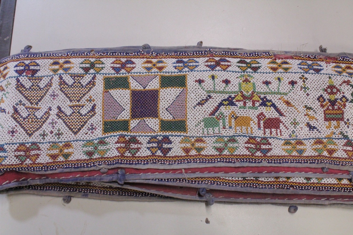 AN EARLY 20TH CENTURY WESTERN INDIAN GUJARAT LONG BEADWORK PANEL, with polychrome stylised geometric - Image 5 of 7