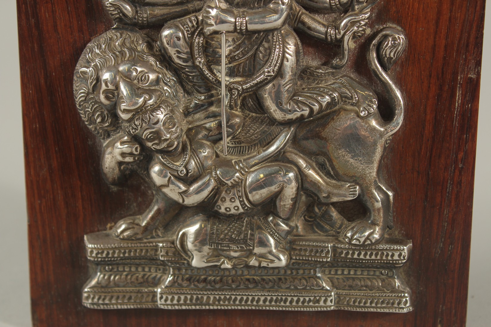 A FINE SOUTH INDIAN SILVER HINDU DEITY MOUNTED TO A WOODEN PLAQUE, 16cm high. - Image 3 of 4
