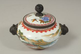 A CHINESE ENAMELLED TWIN HANDLE CENSER AND COVER, painted with a landscape scene as well as flora