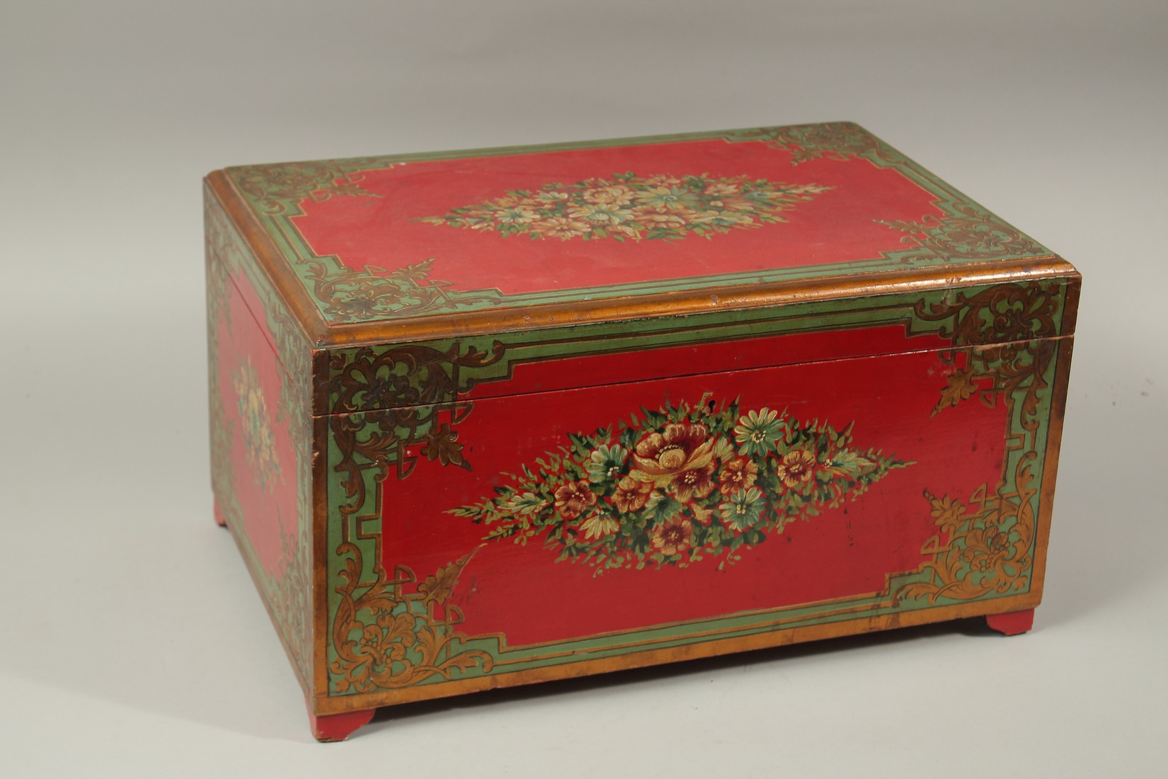 A LARGE 19TH CENTURY QAJAR PAINTED WOOD CASHIER BOX, raised on four bracket feet, 51cm wide, 33cm