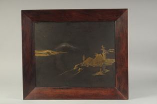 A FINE JAPANESE MEIJI PERIOD GOLD AND SILVER INLAID IRON PANEL, depicting and landscape scene with