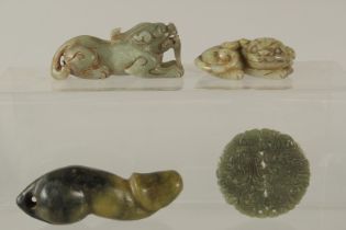 A COLLECTION OF FOUR CHINESE CARVED JADE PIECES, (4).