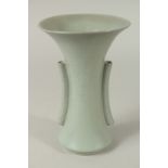 A CHINESE CELADON GLAZED PORCELAIN TRUMPET-FORM VASE, with twin handles, the with incised