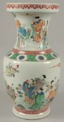 A LARGE CHINESE POLYCHROME PORCELAIN BALUSTER VASE, painted with immortals, with greek key bands