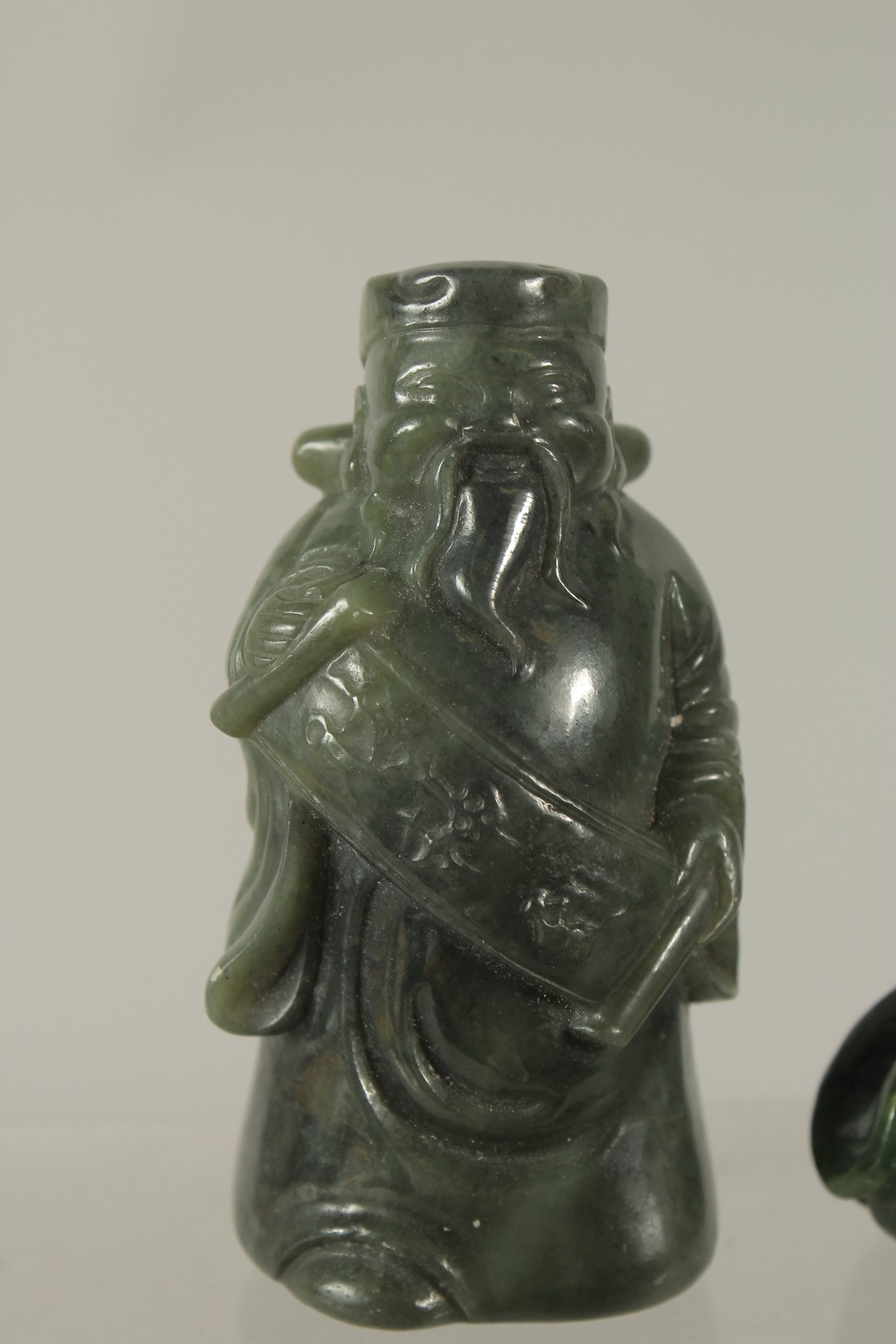 A COLLECTION OF THREE CARVED GREEN HARDSTONE PIECES, (3). - Image 2 of 4