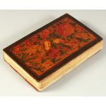 A FINE PERSIAN QAJAR LACQUERED COVER QURAN, signed and dated, the covers painted with flora, 15cm