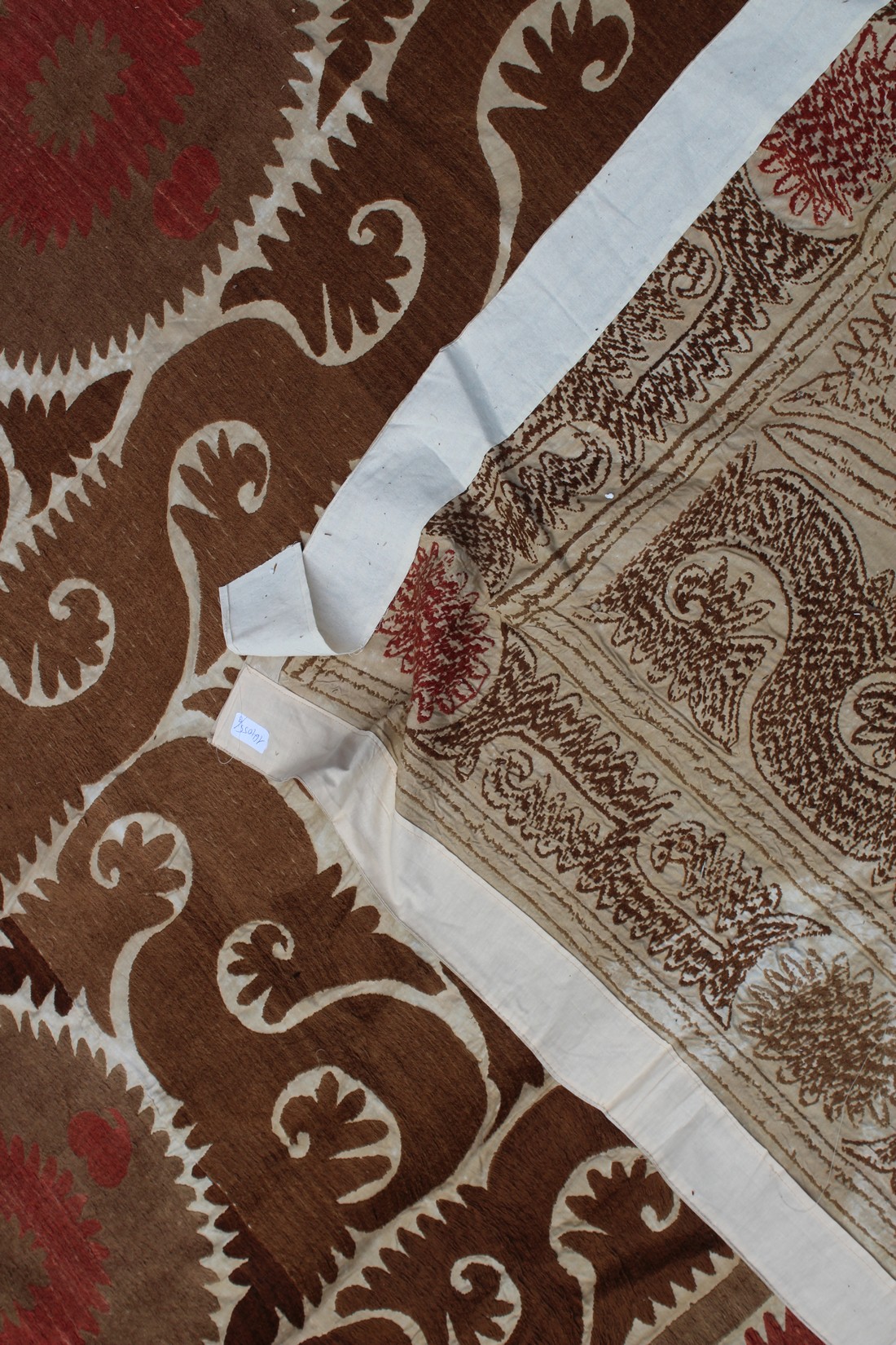 A VERY LARGE 20TH CENTURY SAMARKAND UZBEKISTAN WEDDING SUZANI TEXTILE, in light browns and reds on - Image 8 of 8