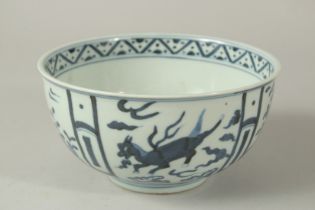 A CHINESE BLUE AND WHITE PORCELAIN BOWL, decorated with panels of horses and flora, base with