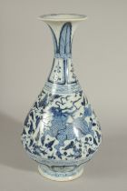 A CHINESE BLUE AND WHITE PORCELAIN VASE, painted mythical beast and phoenix, 26cm high.