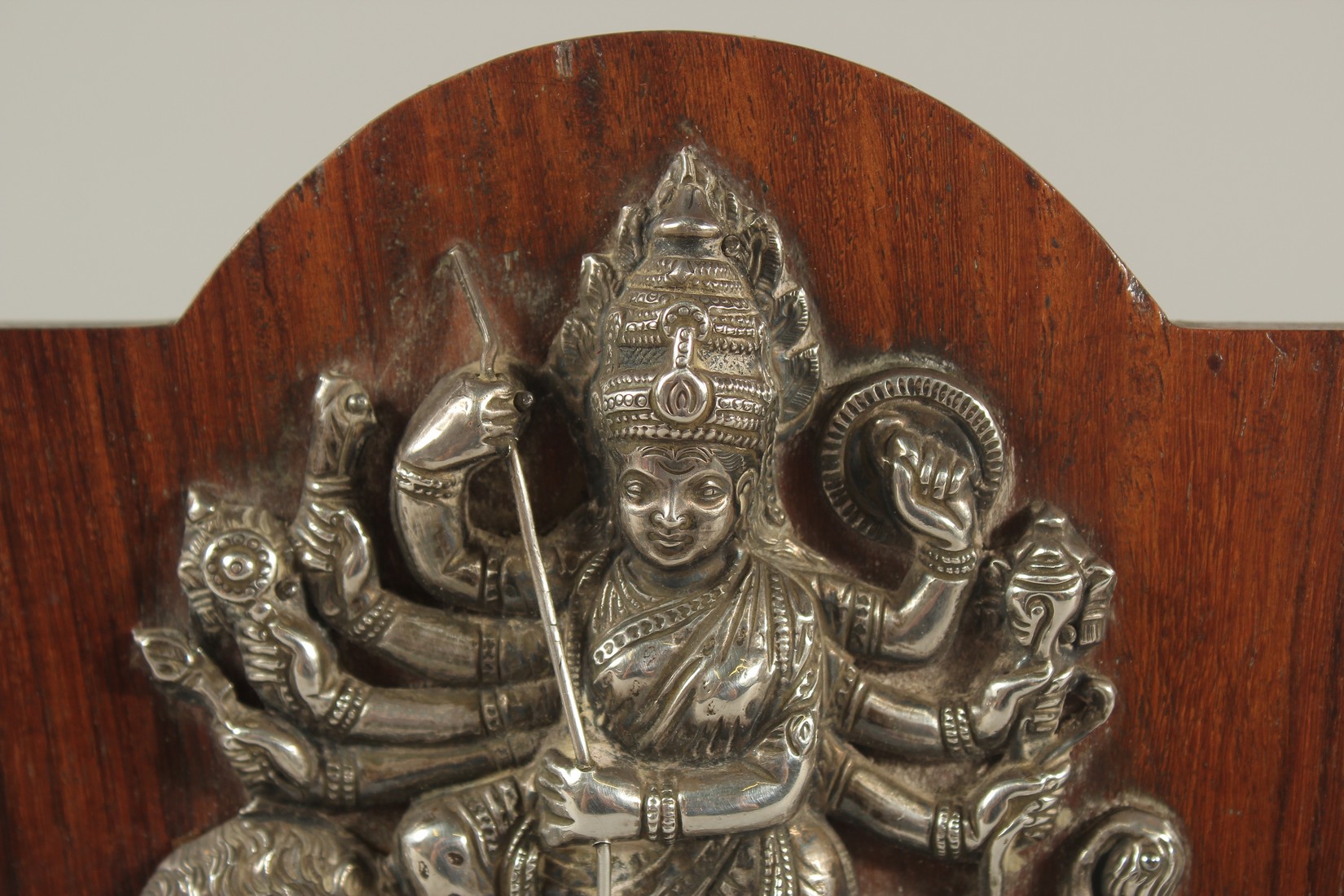 A FINE SOUTH INDIAN SILVER HINDU DEITY MOUNTED TO A WOODEN PLAQUE, 16cm high. - Image 2 of 4