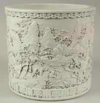 A VERY LARGE CHINESE DEHUA PORCELAIN BRUSH POT, relief-decorated with an expansive landscape: