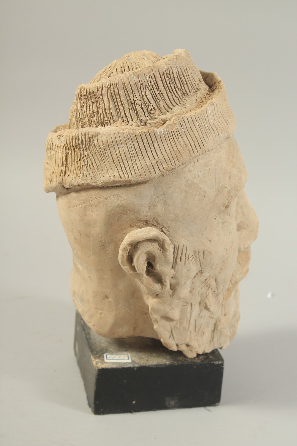 A CARVED CLAY HEAD SCULPTURE, raised on stand. - Image 4 of 4