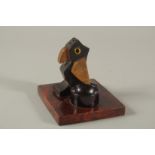 AN EARLY 20TH CENTURY ART DECO DUNHILL STYLE BIRD-SHAPED MATCH HOLDER, with bakelite or cherry amber