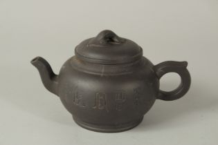 A CHINESE YIXING PURPLE CLAY TEAPOT WITH CARVED CHARACTERS AND RUYI FINIAL, the base with