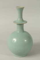 AN UNUSUAL CHINESE CELADON GLAZED BOTTLE VASE, 28cm high.