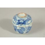 A SMALL 19TH CENTURY CHINESE BLUE AND WHITE PORCELAIN LIDDED POT, with floral decoration, 7cm high.