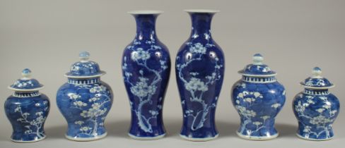 A COLLECTION OF SIX CHINESE BLUE AND WHITE 'PRUNUS' PORCELAIN PIECES, comprising two pairs of jars