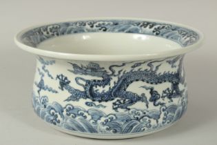 A CHINESE BLUE AND WHITE PORCELAIN DRAGON WATER BASIN, finely decorated with dragons amongst