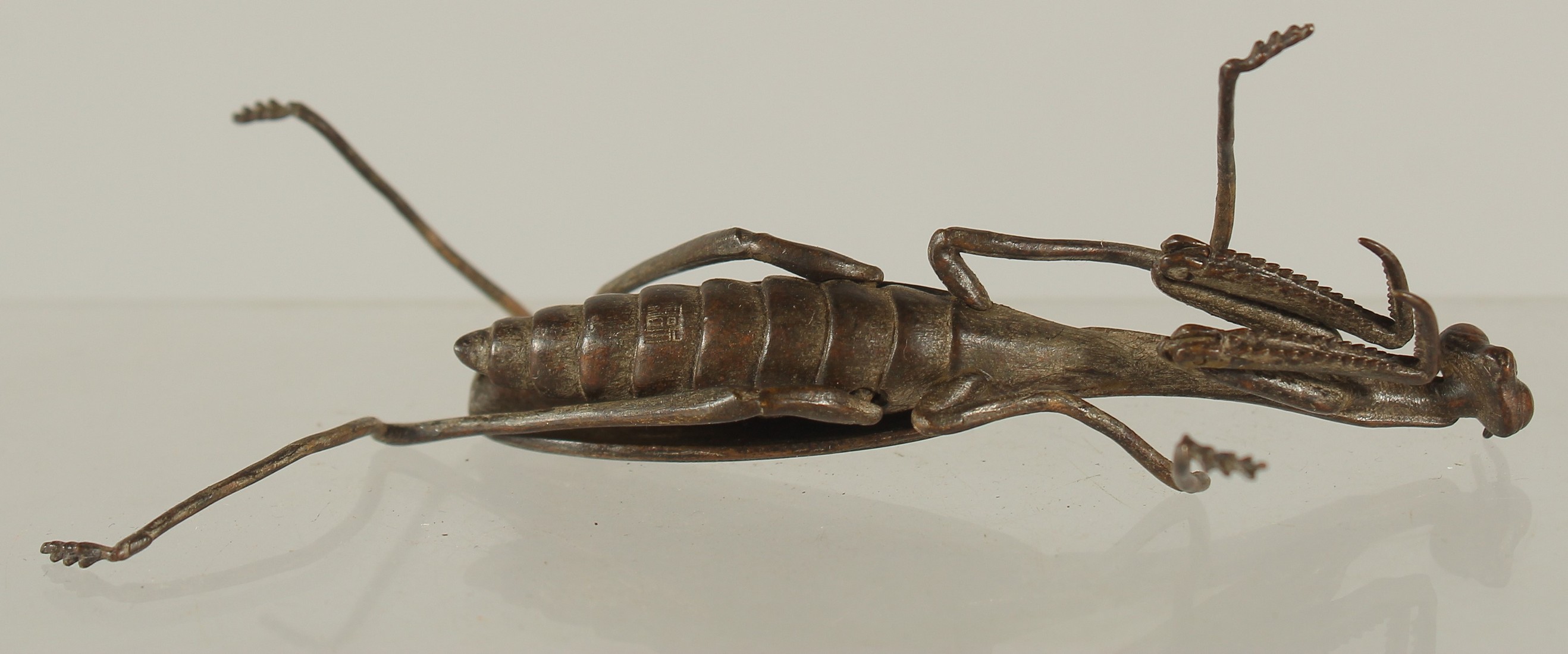 A BRONZE OKIMONO OF A PRAYING MANTIS, 10cm long. - Image 2 of 2