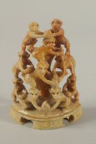 A 19TH CENTURY CHINESE FINELY CARVED SOAPSTONE GROUP DEPICITNG A PYRAMID OF MONKEYS, 11cm high.